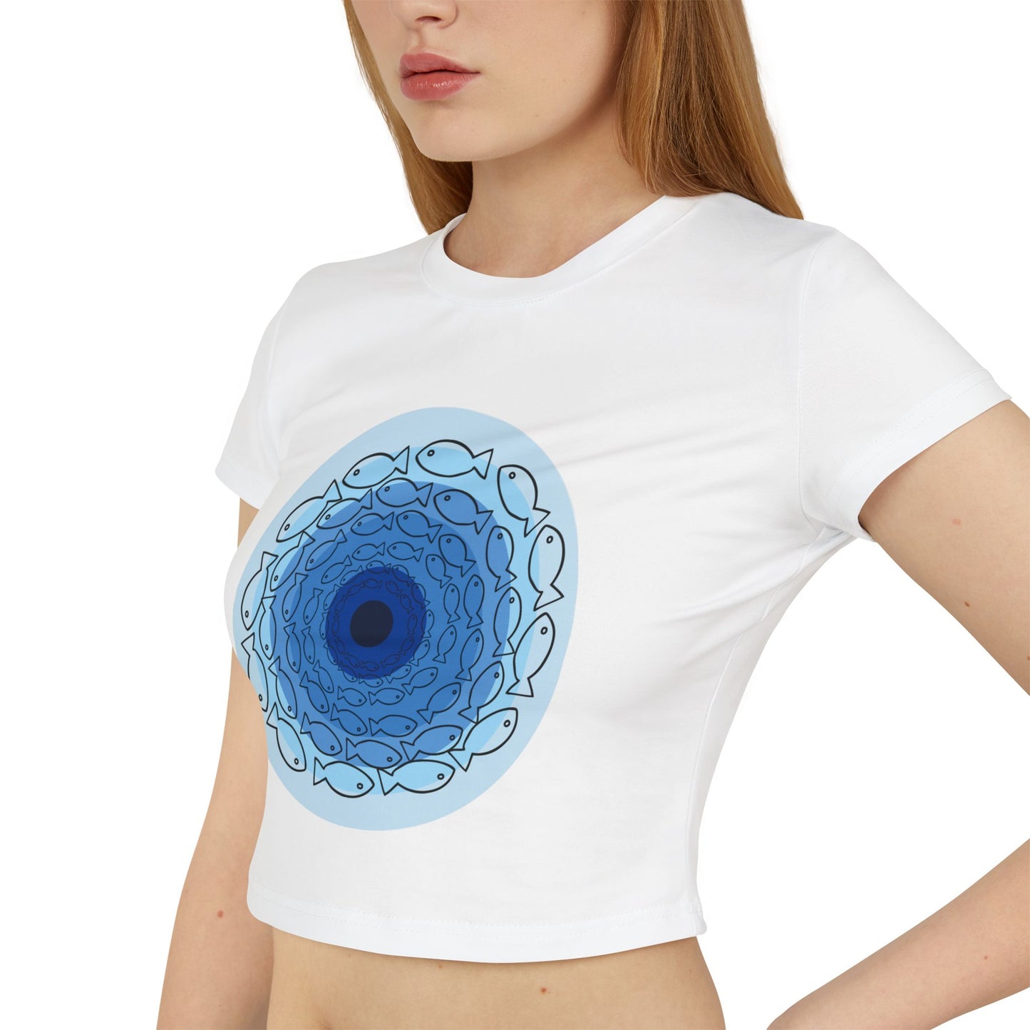 White t-shirt with a blue circular design featuring fish outlines worn by a person.
