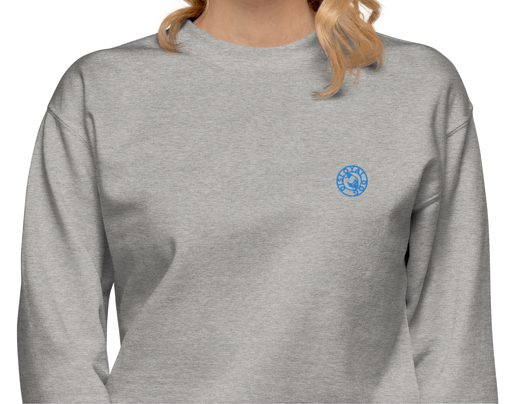 Woman wearing a light gray sweatshirt with a light blue Disloyal Dog logo on the left side of the chest.